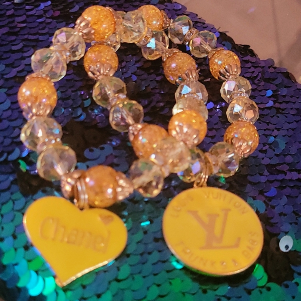 Two Beeded Stretch Braclets with Charms
